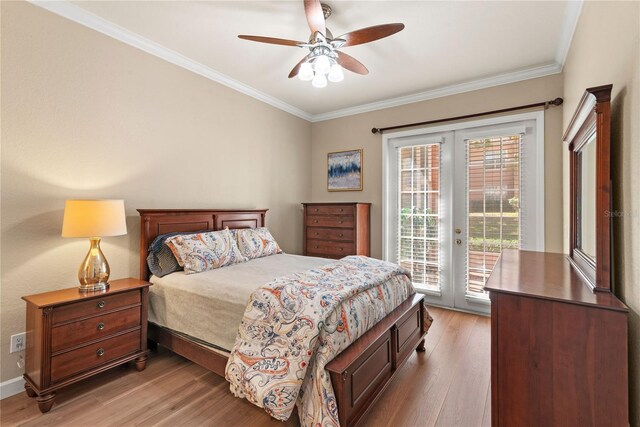 7628 Bay Port Rd Unit 43, Orlando, FL 32819 - bedroom with french doors, access to outside, light wood finished floors, crown molding, and ceiling fan