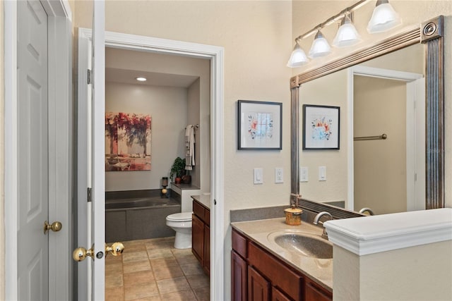 7628 Bay Port Rd Unit 43, Orlando, FL 32819 - full bathroom with vanity, a garden tub, toilet, and tile patterned flooring