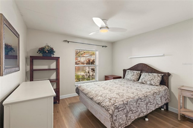 7628 Bay Port Rd Unit 43, Orlando, FL 32819 - bedroom featuring light wood finished floors, a ceiling fan, and baseboards