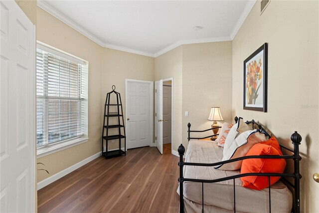 7628 Bay Port Rd Unit 43, Orlando, FL 32819 - sitting room with wood finished floors, crown molding, and baseboards