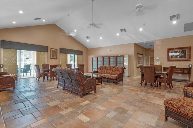 7628 Bay Port Rd Unit 43, Orlando, FL 32819 - living room featuring high vaulted ceiling, ceiling fan, plenty of natural light, stone tile flooring, and recessed lighting