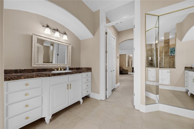 5025 Down Point Ln, Windermere, FL 34786 - bathroom with a tile shower, vanity, tile patterned floors, and baseboards