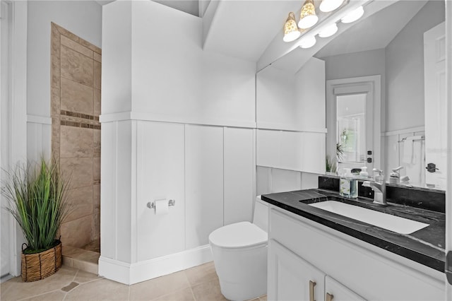 5025 Down Point Ln, Windermere, FL 34786 - full bath with a wainscoted wall, a decorative wall, vanity, a tile shower, and toilet
