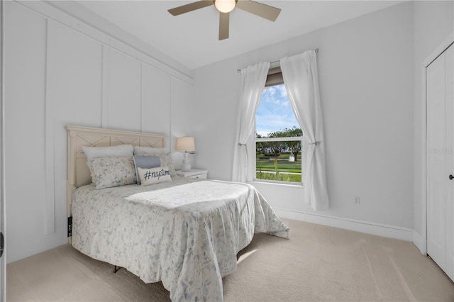 5025 Down Point Ln, Windermere, FL 34786 - bedroom featuring light carpet and a ceiling fan