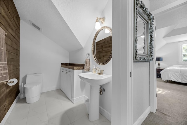 5025 Down Point Ln, Windermere, FL 34786 - bathroom with lofted ceiling, ensuite bathroom, toilet, a sink, and marble finish floors