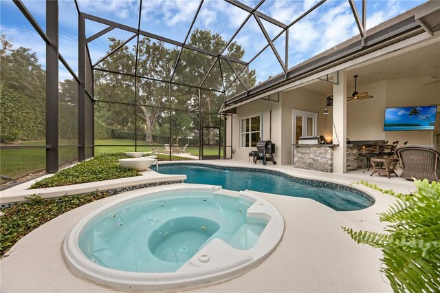 5025 Down Point Ln, Windermere, FL 34786 - view of pool with an outdoor kitchen, a patio area, a lanai, a pool with connected hot tub, and a grill