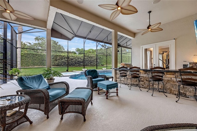 5025 Down Point Ln, Windermere, FL 34786 - sunroom / solarium featuring ceiling fan, an outdoor bar, vaulted ceiling, a pool, and french doors