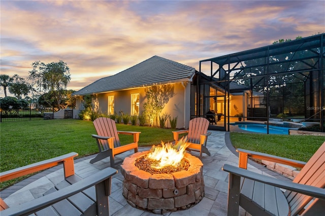 5025 Down Point Ln, Windermere, FL 34786 - patio terrace at dusk featuring an outdoor fire pit, an outdoor pool, and glass enclosure