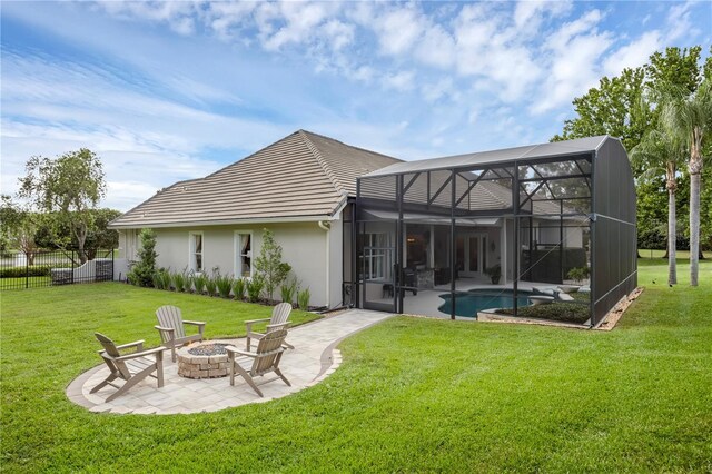 5025 Down Point Ln, Windermere, FL 34786 - rear view of property featuring an outdoor fire pit, a patio area, a lanai, and a tile roof