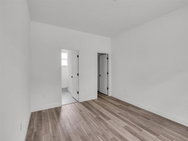 2071 W Doral Ct, Citrus Springs, FL 34434 - empty room featuring light wood-style floors and baseboards