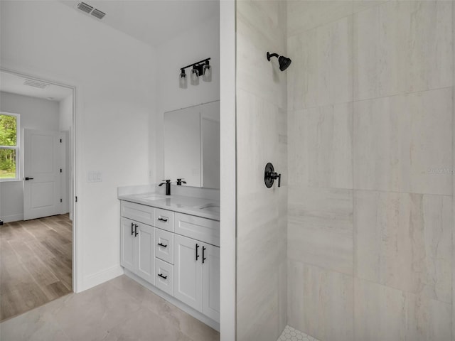 2071 W Doral Ct, Citrus Springs, FL 34434 - full bath featuring tiled shower, double vanity, and baseboards