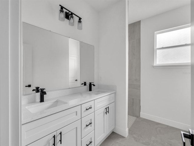2071 W Doral Ct, Citrus Springs, FL 34434 - full bathroom featuring double vanity, a tile shower, marble look tile flooring, and baseboards