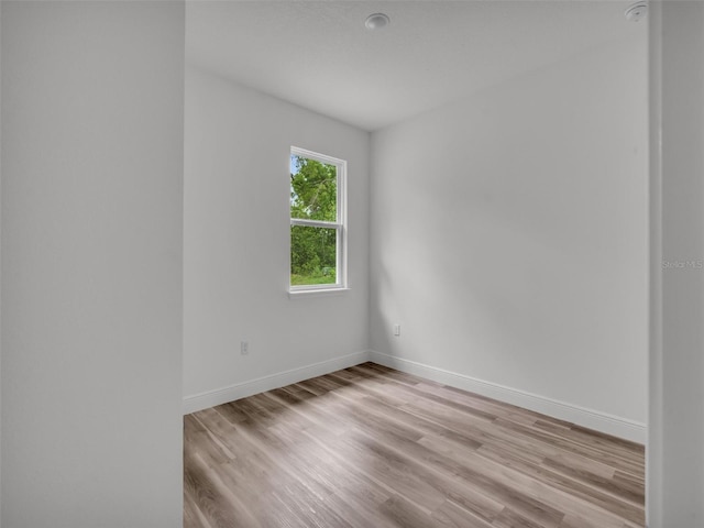 2071 W Doral Ct, Citrus Springs, FL 34434 - unfurnished room featuring light wood-style floors, baseboards, and a smoke detector