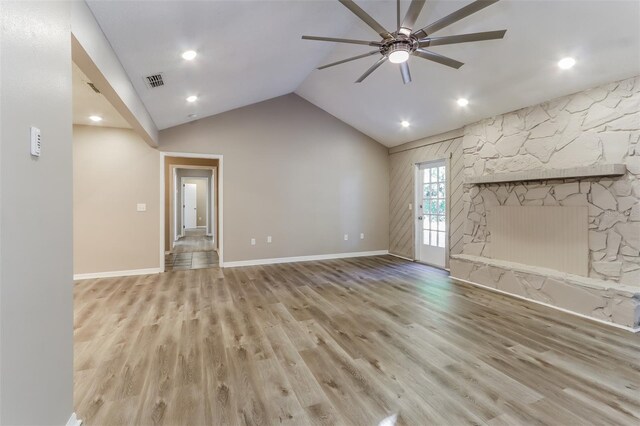 4265 Old Colony Rd, Mulberry, FL 33860 - unfurnished living room featuring a ceiling fan, wood finished floors, vaulted ceiling, baseboards, and a fireplace
