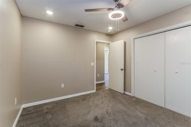 4265 Old Colony Rd, Mulberry, FL 33860 - unfurnished bedroom featuring carpet flooring, a closet, baseboards, ceiling fan, and recessed lighting
