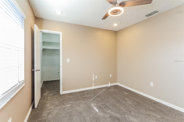 4265 Old Colony Rd, Mulberry, FL 33860 - unfurnished bedroom featuring carpet floors, a spacious closet, and baseboards