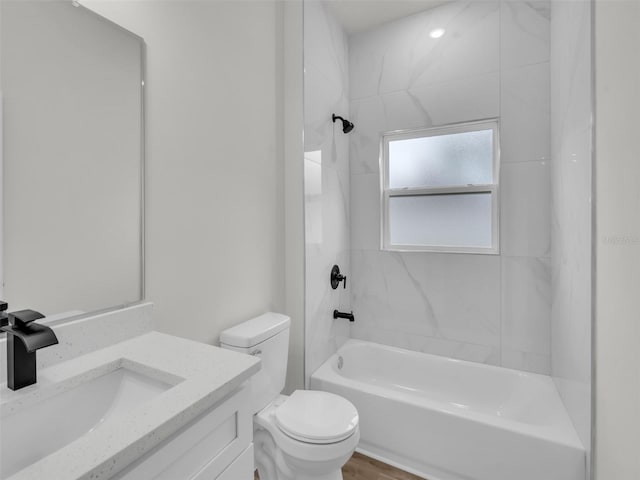 full bath with  shower combination, toilet, and vanity