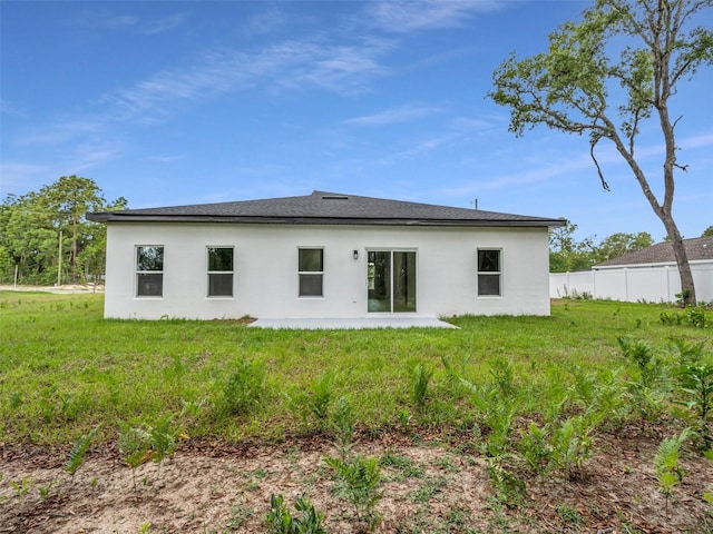 back of house with stucco siding and a patio area
