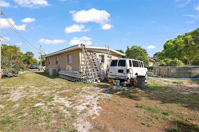 1508 Roger Babson Rd, Orlando, FL 32808 - view of property exterior featuring an outdoor pool and central air condition unit