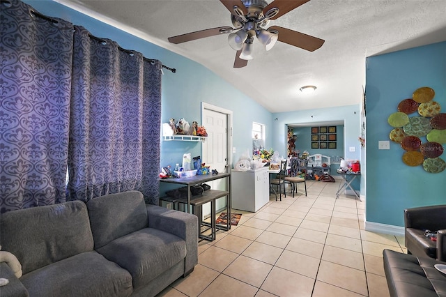 1508 Roger Babson Rd, Orlando, FL 32808 - living area featuring vaulted ceiling, light tile patterned flooring, a ceiling fan, and baseboards