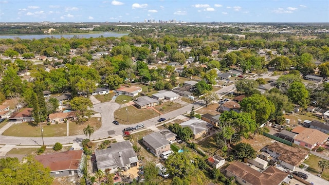 1508 Roger Babson Rd, Orlando, FL 32808 - aerial view of property and surrounding area featuring nearby suburban area, a nearby body of water, and a tree filled landscape