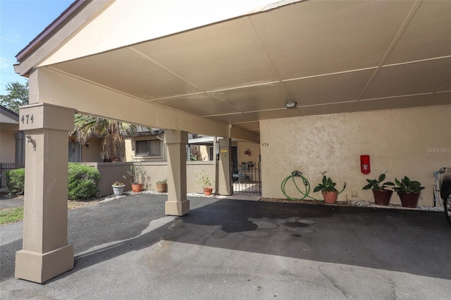 474 Windmeadows St Unit 0, Altamonte Springs, FL 32701 - view of patio featuring fence and a carport