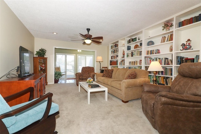 474 Windmeadows St Unit 0, Altamonte Springs, FL 32701 - living area featuring a textured ceiling, a ceiling fan, and light colored carpet