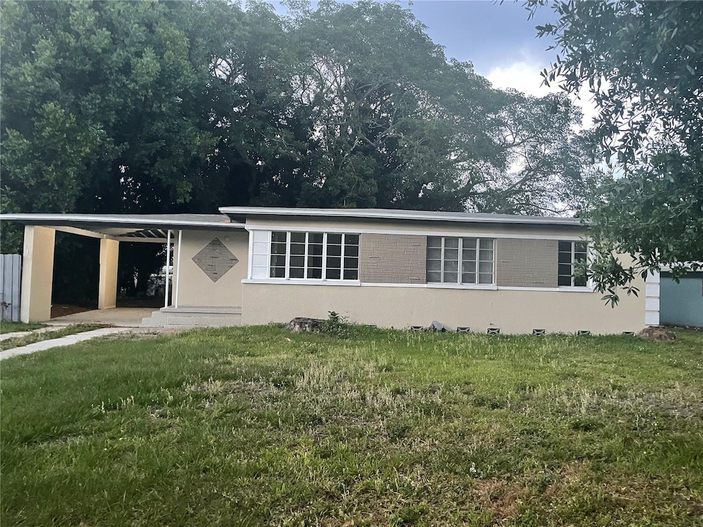 715 Mercado Ct, Orlando, FL 32807 - view of front of property featuring a front yard and stucco siding