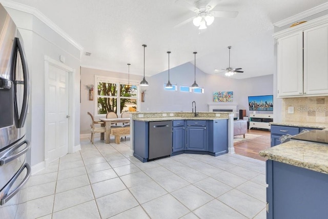 1837 Sweetwater W Cir, Apopka, FL 32712 - kitchen featuring stainless steel appliances, a ceiling fan, blue cabinets, open floor plan, and white cabinetry