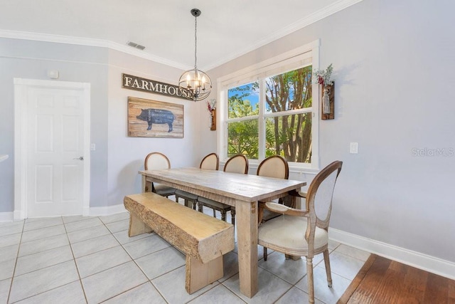 1837 Sweetwater W Cir, Apopka, FL 32712 - dining space featuring a chandelier, light tile patterned floors, baseboards, and crown molding