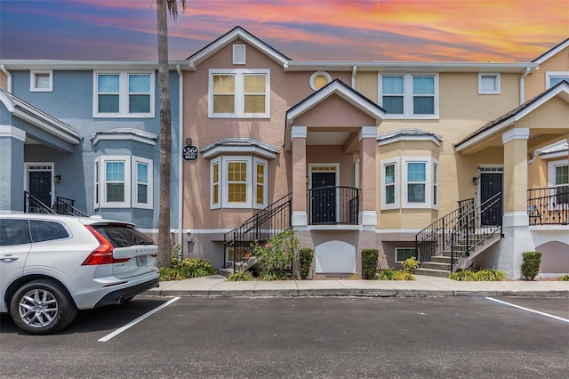 6611 Time Square Ave Unit 103, Orlando, FL 32835 - townhome / multi-family property featuring stucco siding and stairway