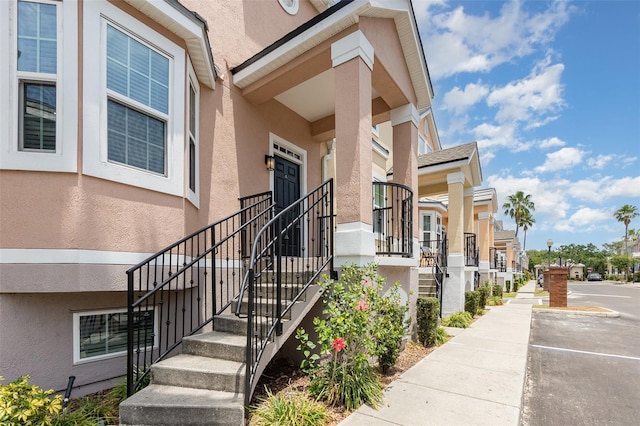 6611 Time Square Ave Unit 103, Orlando, FL 32835 - property entrance with stucco siding and a residential view