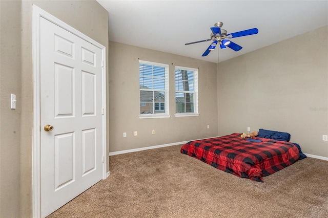 6611 Time Square Ave Unit 103, Orlando, FL 32835 - bedroom with carpet flooring, baseboards, and a ceiling fan
