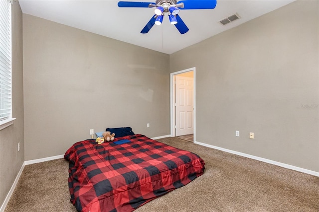 6611 Time Square Ave Unit 103, Orlando, FL 32835 - carpeted bedroom with baseboards and ceiling fan