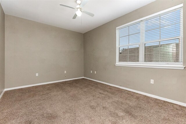 6611 Time Square Ave Unit 103, Orlando, FL 32835 - carpeted empty room featuring a ceiling fan and baseboards