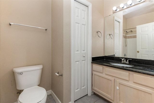 6611 Time Square Ave Unit 103, Orlando, FL 32835 - full bathroom with toilet, vanity, tile patterned floors, and baseboards