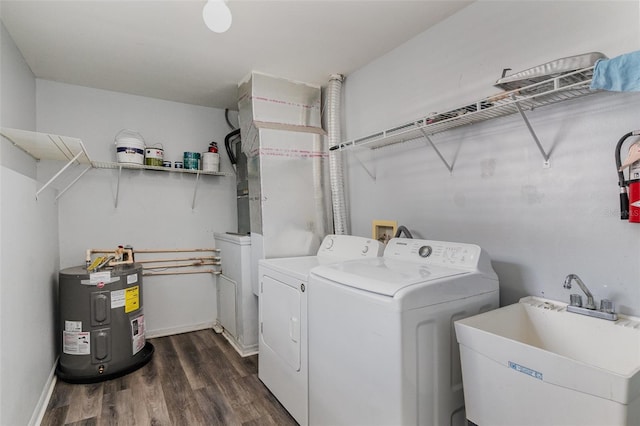 6611 Time Square Ave Unit 103, Orlando, FL 32835 - laundry area featuring electric water heater, independent washer and dryer, and dark wood finished floors