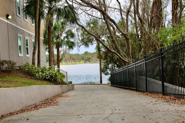 6611 Time Square Ave Unit 103, Orlando, FL 32835 - view of asphalt road with a water view