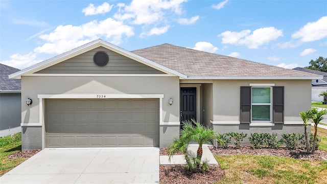 7054 Cruz Ct, Lakeland, FL 33813 - single story home featuring stucco siding, a garage, concrete driveway, and a shingled roof