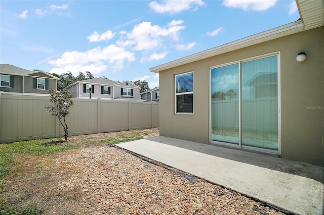 7054 Cruz Ct, Lakeland, FL 33813 - view of yard with fence, a patio area, and a residential view