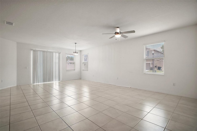 7054 Cruz Ct, Lakeland, FL 33813 - spare room with a ceiling fan, healthy amount of natural light, and light tile patterned floors