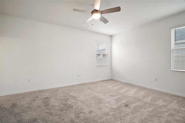 7054 Cruz Ct, Lakeland, FL 33813 - spare room featuring plenty of natural light, a ceiling fan, light carpet, and baseboards