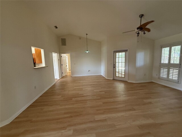 unfurnished room with ceiling fan, high vaulted ceiling, healthy amount of natural light, baseboards, and light wood-style floors