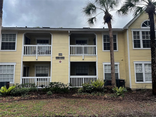 1089 S Hiawassee Rd Unit 323, Orlando, FL 32835 - view of building exterior featuring central air condition unit