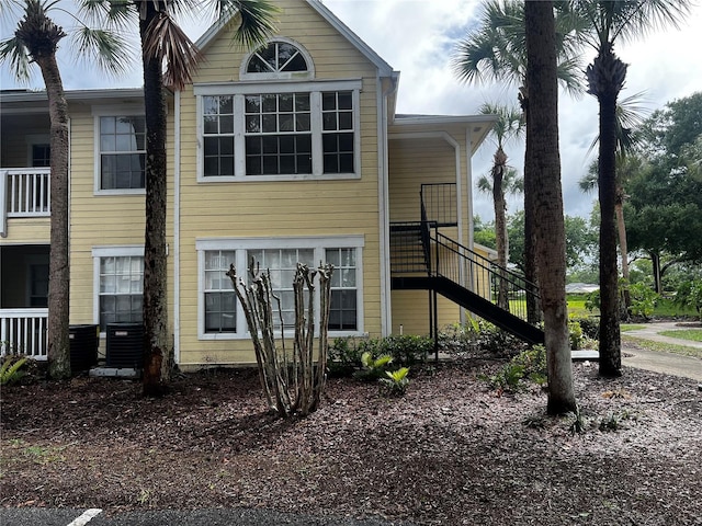 1089 S Hiawassee Rd Unit 323, Orlando, FL 32835 - view of home's exterior featuring stairs and central air condition unit