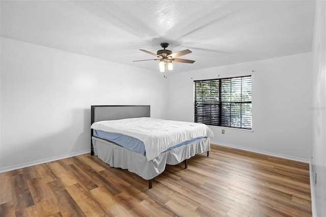 1106 Alpine Ave NW, Palm Bay, FL 32907 - bedroom featuring wood finished floors, baseboards, and ceiling fan
