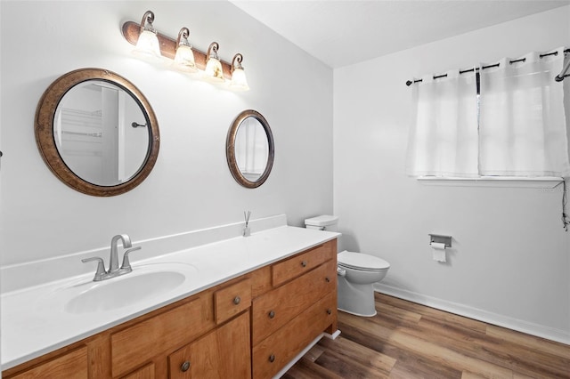 1106 Alpine Ave NW, Palm Bay, FL 32907 - bathroom with wood finished floors, vanity, toilet, and baseboards