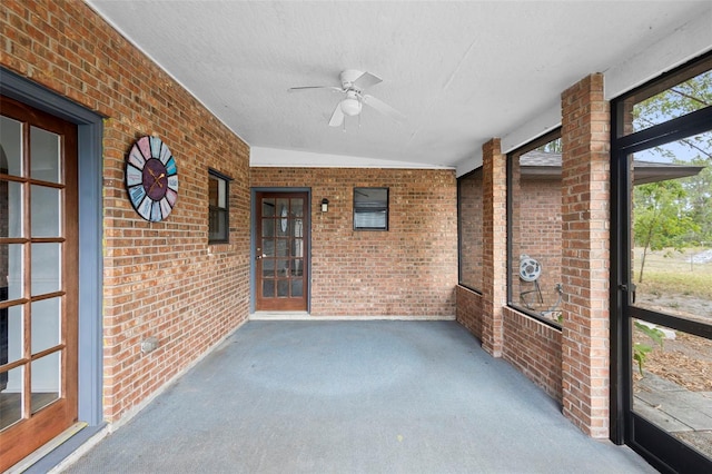 1106 Alpine Ave NW, Palm Bay, FL 32907 - unfurnished sunroom with a ceiling fan and lofted ceiling