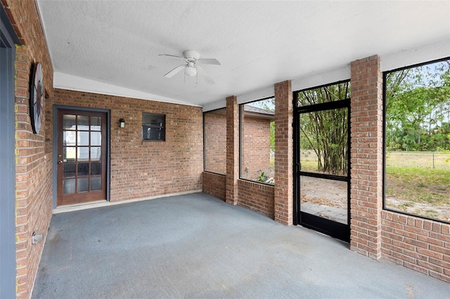 1106 Alpine Ave NW, Palm Bay, FL 32907 - unfurnished sunroom with a ceiling fan, plenty of natural light, and lofted ceiling