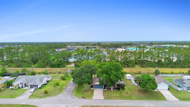 1106 Alpine Ave NW, Palm Bay, FL 32907 - aerial perspective of suburban area featuring a tree filled landscape